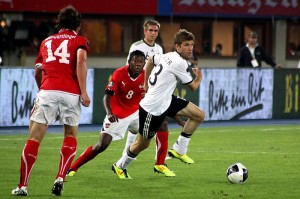 Thomas Müller spins away from Austria's Julian Baumgartlinger and David Alaba, as Philipp Lahm looks on